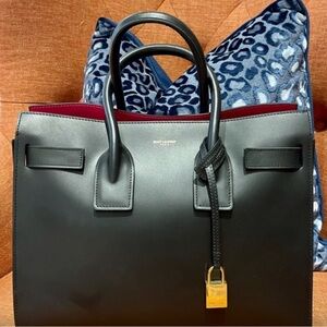 YSL Sac de Jour NM bag - small, smooth leather in Noir with pink lining